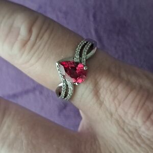 Padparadscha Sapphire & White Zircon Accented Triple Shank Ring.